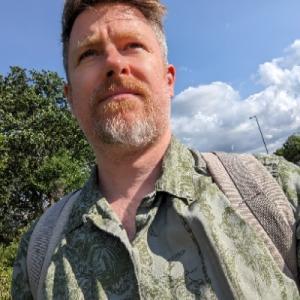 Neil Hopkins (He/Him)