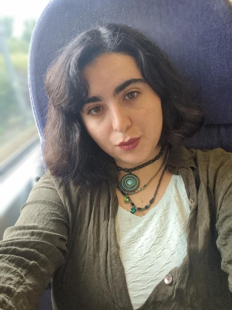 Selfie on the train, green top