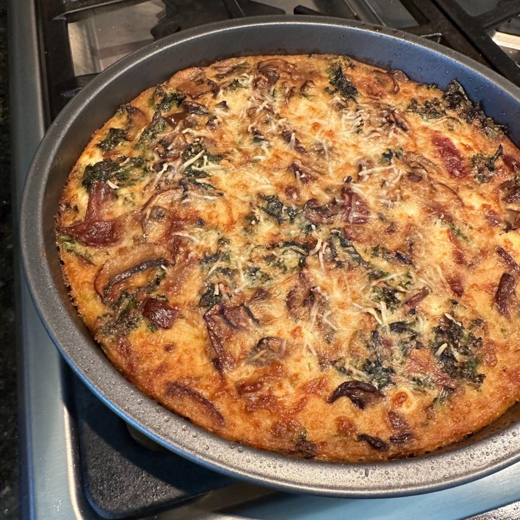 A round pan with a frittata. It might be a little burned around the edges, but it is a nice golden color otherwise.