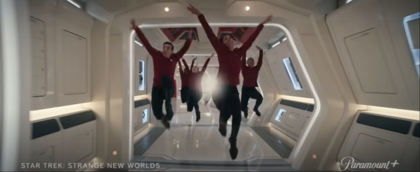 Screenshot from the trailer for Subspace Rhapsody, showing USS Entrerprise crewmembers dancing in the corridor.