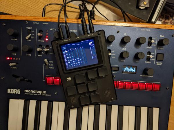 Small Dirtywave M8 synthesizer/sequencer/sampler sitting atop a Korg Monologue. 