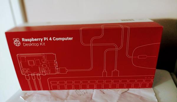 A red cardboard box containing a Radoberry Pi 4 desktop computer kit.