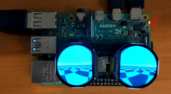 Raspberry Pi 4 with two lenses mounted on top showing a black and white chequered floor displayed by Godot video game engine