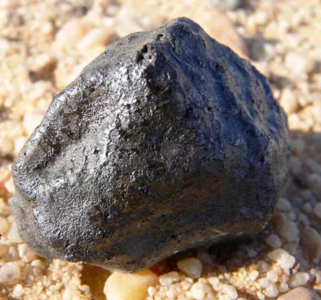 "One of the larger recovered fragments of the asteroid and meteoroid 2008 TC₃." December 8, 2008 Sudan.

Peter Jenniskens, Public domain, via Wikimedia Commons.