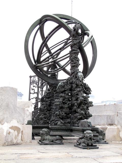"Equatorial Armilla. Qing Dynasty, 1673. Ancient Observatory, Beijing. The Equatorial Armilla reads the true solar time, right ascension (RA) difference, and declination of celestial bodies. Its supporting pillars are incrusted with a riot of exuberant decoration. Equatorial coordinates refer to the Earth's equator, while ecliptic coordinates refer to the plane of the Sun's orbit."

G41rn8, CC BY-SA 4.0, via Wikimedia Commons.