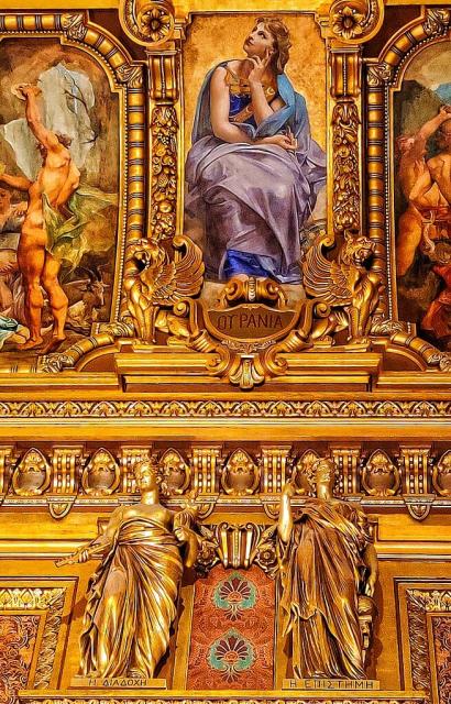 "Urania, Diadochi and Episteme in Palais Garnier at Paris. Their names are in Greek, Urania = ΟΥΡΑΝΙΑ, Diadochi = Η ΔΙΑΔΟΧΗ and Episteme = Η ΕΠΙΣΤΗΜΗ."

Gre regiment, CC BY-SA 4.0, via Wikimedia Commons.