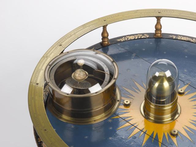 Orrery, tellurium or planetary model made for Charles Boyle, the fourth Earl of Orrery by John Rowley, Fleet Street, London (~1712).

Science Museum GroupCC BY-NC-SA 4.0 via Orrery made by John Rowley for the Earl of Orrery. 1952-73 Science Museum Group Collection Online. https://collection.sciencemuseumgroup.org.uk/objects/co56970/orrery-made-by-john-rowley-for-the-earl-of-orrery-demonstration-models-orreries-planetaria-models