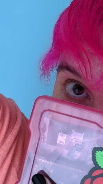 A silly electronic boy with silly pink hair