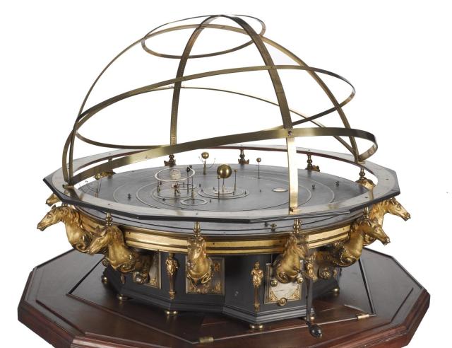 George 2nd's Grand Orrery, made new in 1733 by Thomas Wright.

Science Museum Group, CC BY-NC-SA 4.0 via George 2nd's Grand Orrery. 1927-1659 Science Museum Group Collection Online. https://collection.sciencemuseumgroup.org.uk/objects/co1522/george-iis-grand-orrery-orrery
