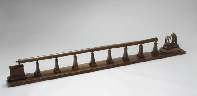 Walnut and brass model of the "Great Paris Telescope" exhibited at the 1900 Paris Exposition.

Science Museum Group, CC BY-SA 4.0 via Walnut and brass model of the "Great Paris Telescope". 1993-740 Science Museum Group Collection Online. https://collection.sciencemuseumgroup.org.uk/objects/co57256/walnut-and-brass-model-of-the-great-paris-telescope-models-representation-telescope-refracting