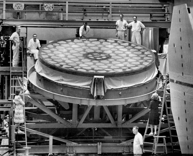 "The mirror of the 200-inch Hale telescope at Mt. Palomar Observatory, California in the Caltech Optical Shop in Pasadena when grinding work was resumed following the end of World War 2" (December 4, 1945).

Paul Calvert, Los Angeles Times, Public domain, via Wikimedia Commons.