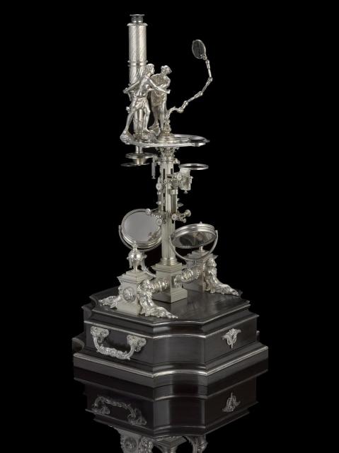"Silver 'Universal Double Microscope' with ornate decoration by George Adams the Elder, Fleet Street, London, c. 1763."

Science Museum Group, CC BY-NC-SA 4.0 via Silver microscope by George Adams, c. 1761.. 1949-116 Science Museum Group Collection Online. https://collection.sciencemuseumgroup.org.uk/objects/co8527/silver-microscope-by-george-adams-c-1761-microscopes