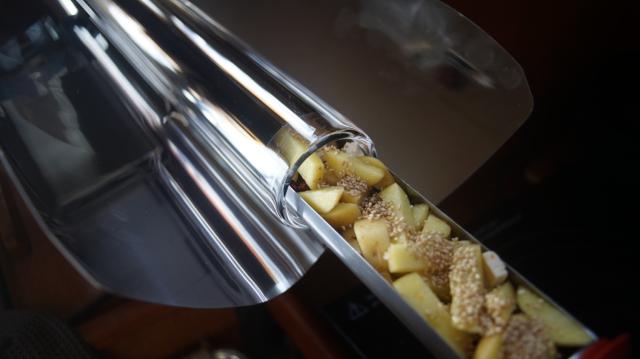 Vacuum tube with potatoes and sesame seeds and olive oil.
