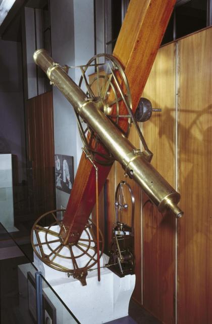 "Refracting telescope with 5.9-inch aperture lens by Charles Tully, brass tube and English type equatorial mounting by George Dollond and clockwork drive."

Science Museum Group, CC BY-SA 4.0 via Refracting telescope with 5.9-inch aperture lens, brass tube and English type equatorial mounting and clockwork drive. 1929-949 Science Museum Group Collection Online. https://collection.sciencemuseumgroup.org.uk/objects/co56941/refracting-telescope-with-5-9-inch-aperture-lens-brass-tube-and-english-type-equatorial-mounting-and-clockwork-drive-telescope-refracting