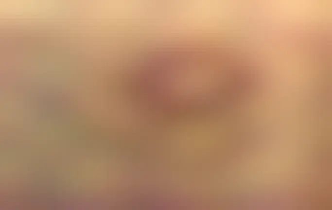 A large orange volcano is pictured on Mars from above.