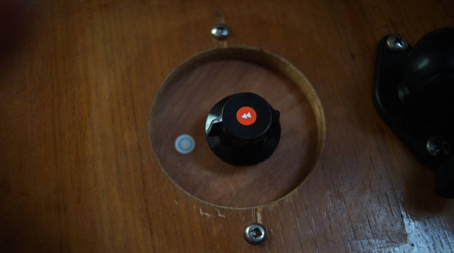 a little knob for a rheostat with stickers on it, indicating the on and off state.