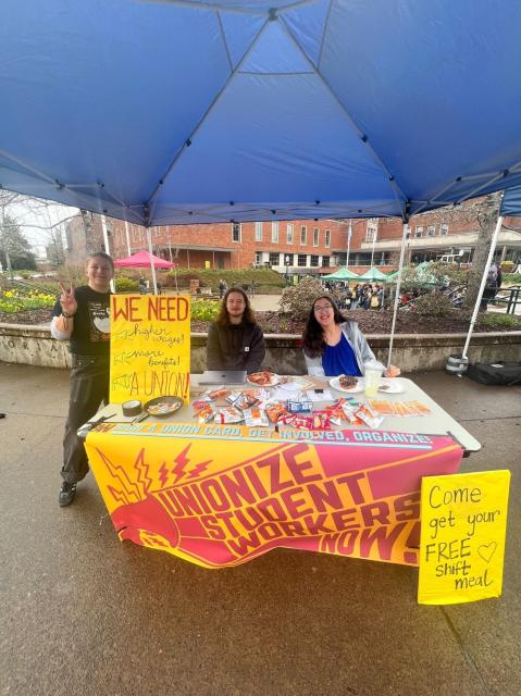 Our brave, smiling, student worker organizers tabling for UOSW at the rally!