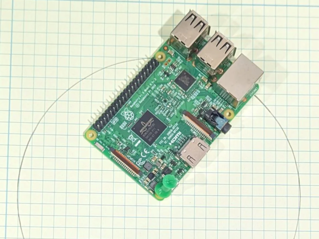 A Raspberry Pi on some graph paper with a thin circle drawn on it