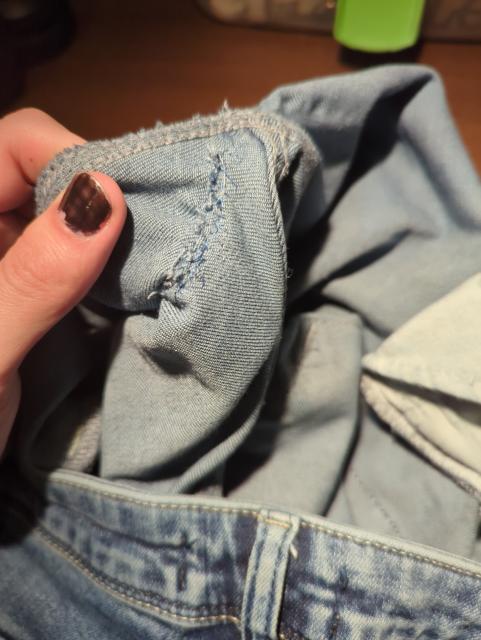 a rather messy stitch job on the inside of my jeans
