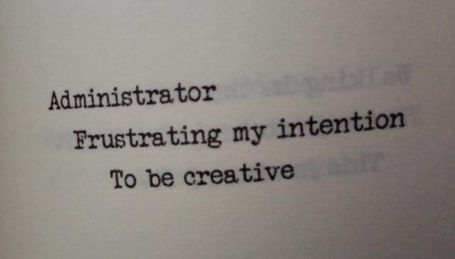 A haiku printed in a typewriter-style font. It reads:

"Administrator
 Frustrating my intention
 To be creative"