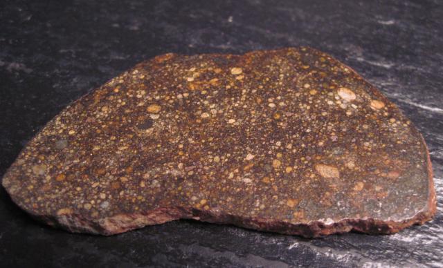 Slice of the Sayh al Uhaymir (SaU) 001 Meteorite.

Jon Taylor, CC BY-SA 2.0, via Wikimedia Commons or Flickr: https://flic.kr/p/8DdZcG