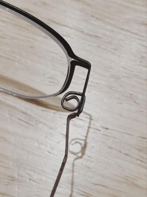 the hinge of a pair of eyeglasses