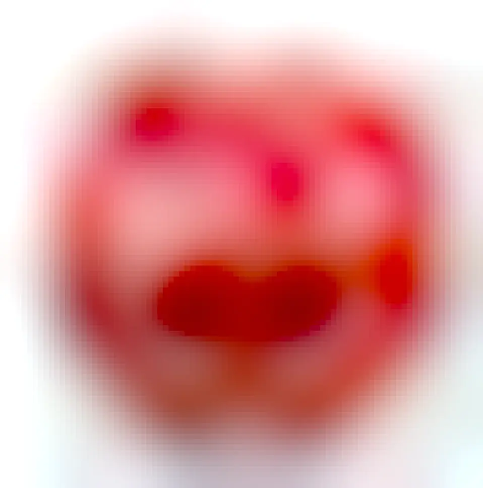 Photo of a ripe pomegranate: a smooth round fruit with a crown-like protrusion where the stalk goes. Its overall shape is similar to the shape of the Medulla Nebula supernova remnant.