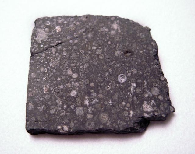 A slice of the Allende Meteorite, observed to fall on February 8, 1969 in Chihuahua, Mexico.

Jon Taylor, CC BY-SA 2.0, via Flickr: https://flic.kr/p/9yD8wi