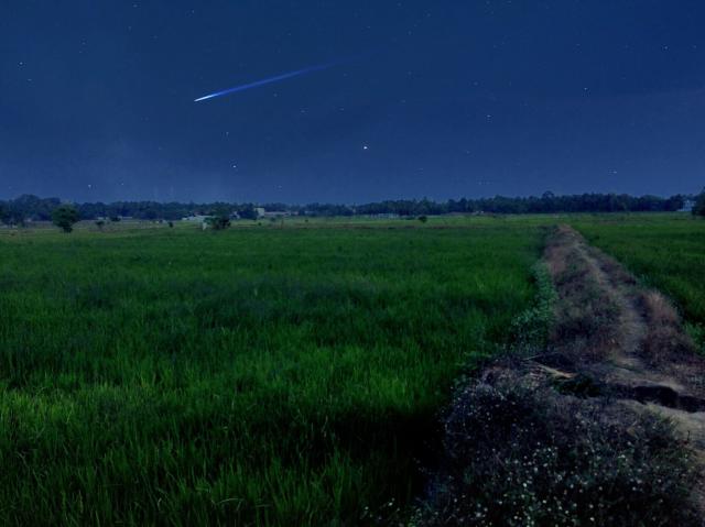 "A quick glimse of shooting star over the paddy fields of Kerala."

Ramesh Kumar R, CC BY-SA 4.0, via Wikimedia Commons.