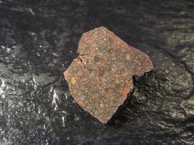 End cut of the Northwest Africa (NWA) 4722 Meteorite.

Jon Taylor, CC BY-SA 2.0, via Flickr: https://flic.kr/p/8on3ej