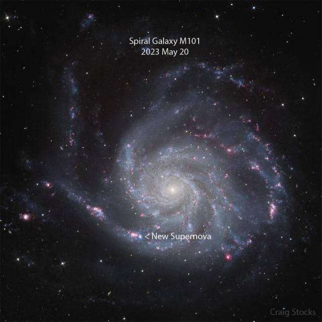 A sprawling spiral galaxy is pictured with a new bright spot visible near the image bottom. This spot is a recently discovered supernova. A roll-over image shows the same galaxy in an image taken the previous month without the new supernova spot.