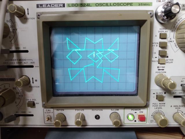 Merv logo on oscilloscope screen, some of the knobs and controls of the scope are visible 