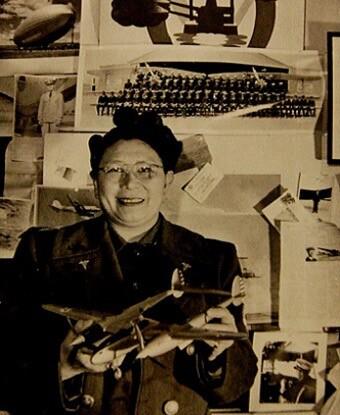 Dr. Margaret Chung with a Lockheed P-38 Lightning model and photos of some of her recruits.
Public domain.