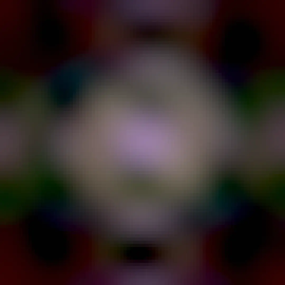 A spiral galaxy is seen in the image center with a distinct purple hue. The galaxy features a bright inner ring, but even outside of that appears another large ring. The outer rings appears light brown. Foreground stars are visible throughout the image.