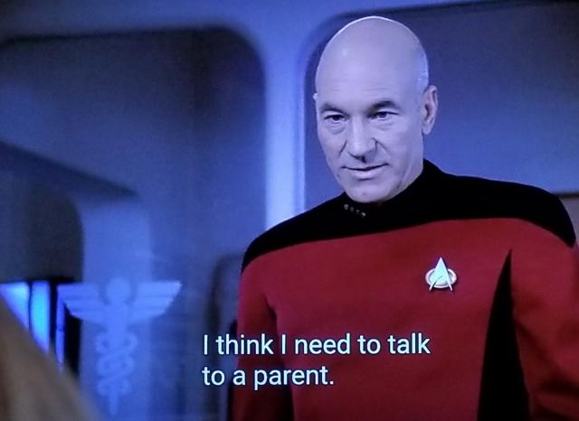 Scene from The Next Generation. We're in sick bay w/ Picard. He's not doing anything out of the ordinary. Just standing there like a guy. Closed caption reads, "I think I need to talk to a parent."