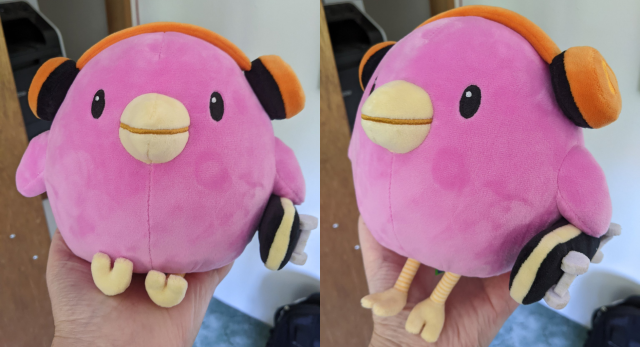 shots of the SkateBIRD plush sitting in my hand, one facing the camera with they lil feets in a seated position, one facing a bit left with they feets dangly
