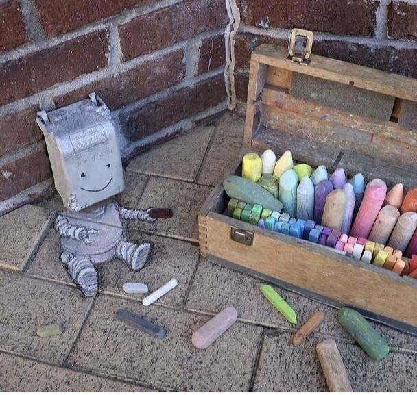 A robot and chalk by David Zinn