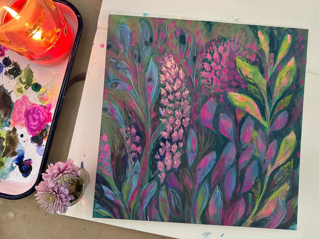 my twitch livestream setup- artwork on the right, paint palette and candle on the left. 