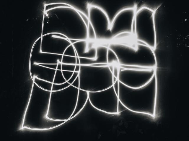 messy version of the Merveilles logo drawn with a flashlight in the dark