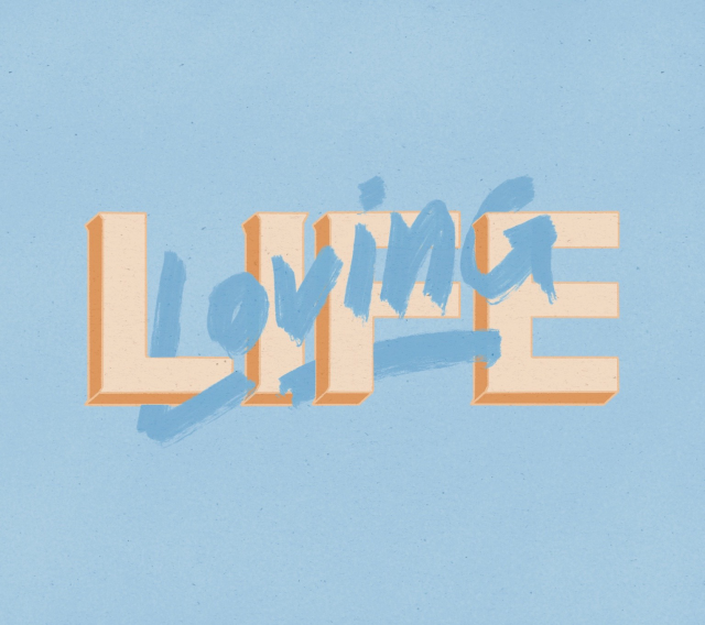 “Loving Life” lettering with Loving being in a script font in entangled with Life