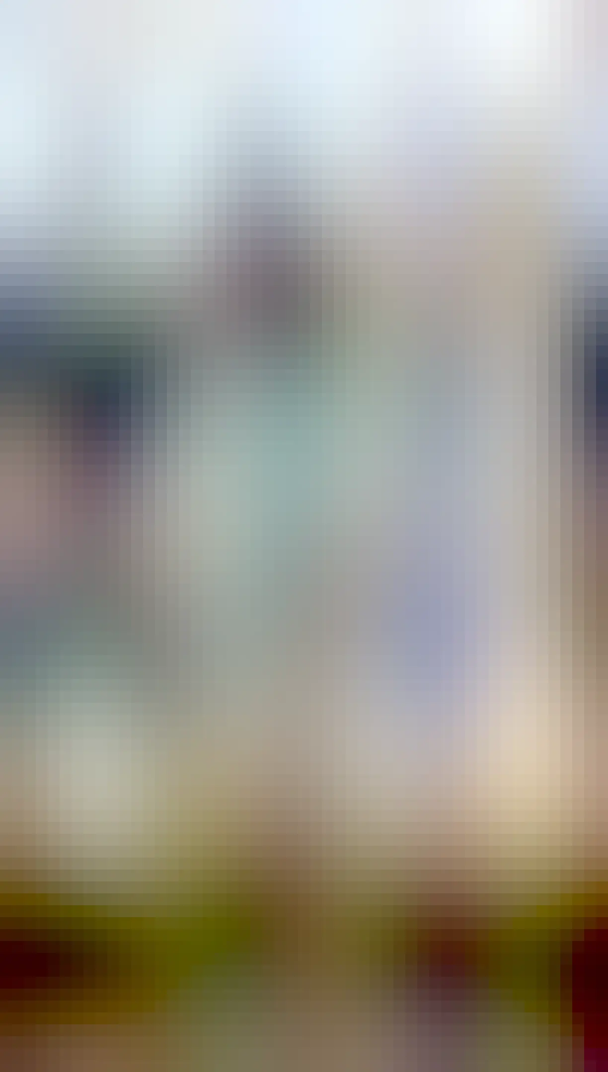 Photo of a bird feeder made from a recycling five litre jug. On side has been cut to make the entrance. The discarded plastic has been used to make awning. It has two wood beams for the bird to land. It is lightly decorated as a French bistró with marker drawing of a table with a bottle of wine and two cups. On the awning it reads “Bistró Restaurant La Pie Voleuse” (the thieving magpie)