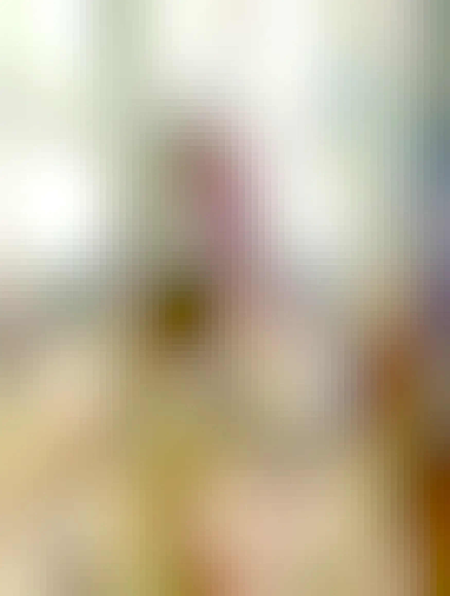 Selfie of me on my couch holding a cup of coffee