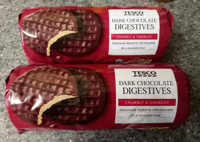 Two packets of Tesco Dark Chocolate Digestive biscuits which are accidentally vegan.