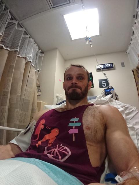 Notthatready in a hospital bed, an IV in his arm