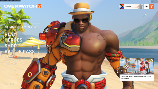 A screenshot of the main menu for overwatch, the character Doomfist stands in the background mostly shirtless wearing sunglasses and a fedora-like straw hat