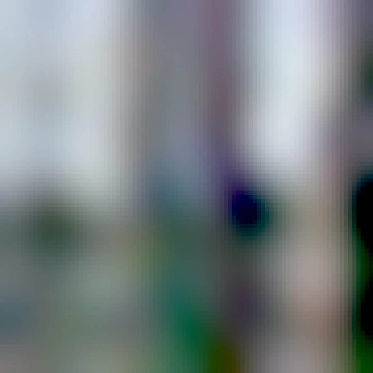 A sticker that says ACAB in the sega logo font stuck on a lamppost.