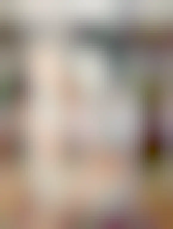 Three printed copies of the Worker coop code on a desk that is also covered in charging cables.