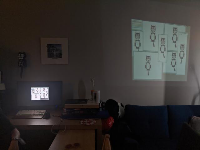 My room: a KitCat clock on a wall, a Plan 9 with a bunch of catclocks running on both the computer monitor and projected onto a wall