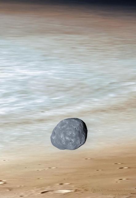 A dark irregularly-shaped moon is seen in front of the red planet Mars. Craters are visible in the foreground and the edge of the planet is just visible at the top of the image.