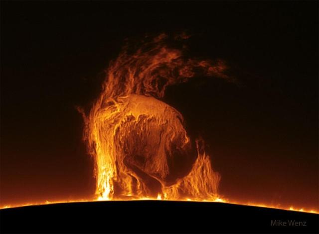 The edge of the Sun is shown sporting a large gaseous prominence that looks like a science-fiction alien.